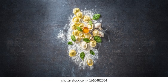 Raw ravioli with flour egg musrooms and and spinach - Top of view. Italian or mediterranean healthy cuisine. - Powered by Shutterstock