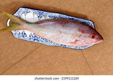 Raw Red Snapper Fish On Decorated Plate, Ready To Season