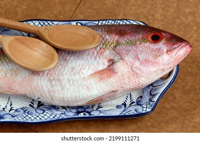 Raw Red Snapper Fish On Decorated Plate, Ready To Season