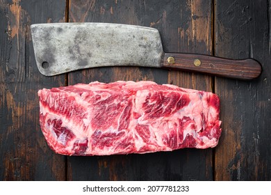 Raw Rib Eye Beef Steak Marbled Meat Whole Cut Set, With Old Butcher Cleaver Knife, On Old Dark  Wooden Table Background, Top View Flat Lay