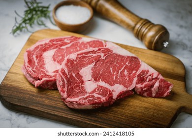 raw ribeye steak beef on white marble background - Powered by Shutterstock