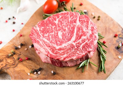Raw Ribeye Steak with Herbs and Spices
