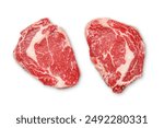 Raw ribeye steaks. Flat lay. Isolated on white background