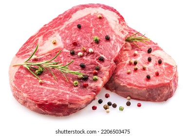 Raw ribeye steaks with peppercorn and rosemary isolated on white background. Closeup.  - Shutterstock ID 2206503475