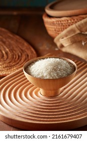 Raw Rice In Wooden Bowl