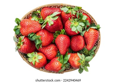 Raw ripe strawberries in a wicker basket isolated on white background, top view, close up. PNG. High quality photo