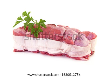 raw roasted pork barded and tied up isolated on white background