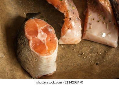 Raw Salmon Filets With Herbs And Spices On Baking Tray