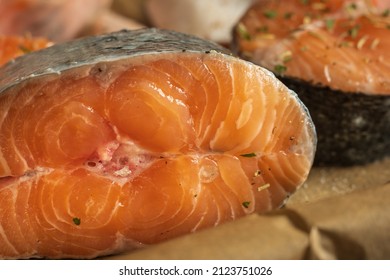 Raw Salmon Filets With Herbs And Spices On Baking Tray