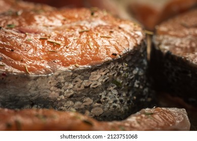 Raw Salmon Filets With Herbs And Spices On Baking Tray