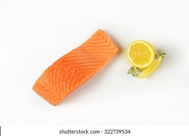 Raw Salmon Fillet On White Background