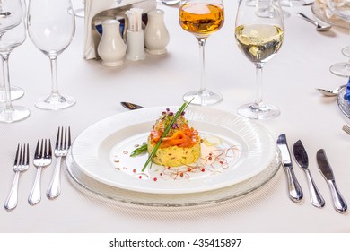 Raw Salmon Fillet With Salad  On A Classy Restaurant Table