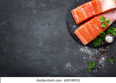 Raw Salmon Fish Fillet On Black Background