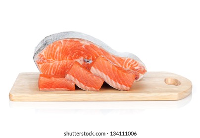 Raw salmon on cutting board. Isolated on white background