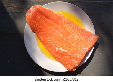 raw salmon on a plate - Shutterstock ID 526857862
