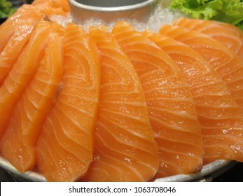 Raw Salmon And Salmon Sashimi Sliced Into Thin Pieces On The Ice Pot Is Popularly Served With A Dipping Sauce And Wasabi, Can Result In Foodborne Illness When Bacteria Or Parasites Are Present