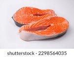 Raw salmon steaks. Salmon, trout, steak, piece of fresh raw fish on a white background.
