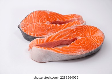 Raw salmon steaks. Salmon, trout, steak, piece of fresh raw fish on a white background. - Powered by Shutterstock