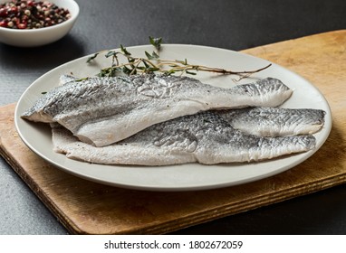 Raw Sea Bass Fillet On A Plate, Seafood.