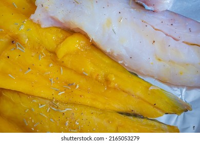 Raw Seasoned Fish Fillets On Baking Tray Closeup