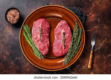 Raw Shoulder Top Blade cut, or Australia wagyu oyster blade beef steak. Dark background. Top View