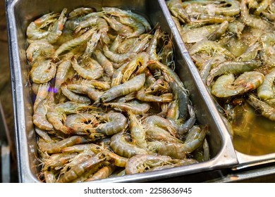 Raw shrimps for sale at street market - Shutterstock ID 2258636945