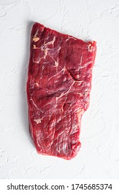 Raw Skirt Or Flank Steak,on A White Stone Background Top View Vertical