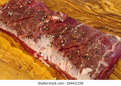 Raw Skirt Steak Seasoned With Salt And Pepper