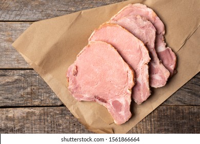 Raw Smoked Pork Chops On Wooden Background