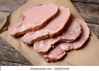 Raw Smoked Pork Chops On Wooden Background