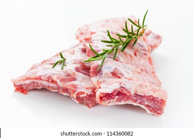 Raw Spare Ribs With Rosemary On White Background