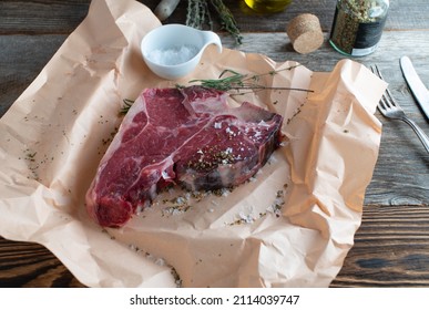 Raw Steak On Butcher Paper. 