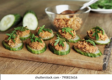 Raw Sunflower Seed & Sun-dried Tomato Pesto Or Dip On Cucumbers. Homemade Vegan Snack With Vegetables.