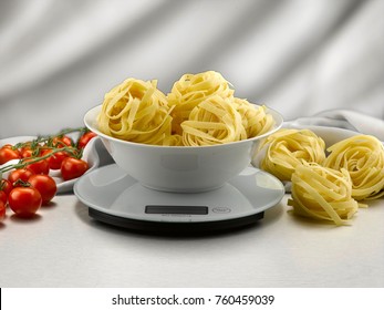 raw tagliatelle plate on kitchen weighing scale