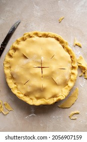 Raw tart, shortcrust pastry with cutted apples, in ceramic tart pan. Baking an apple rustic pie, step by step recipe.