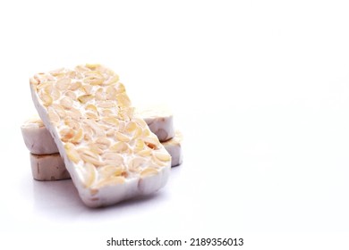 Raw tempeh isolated on white background