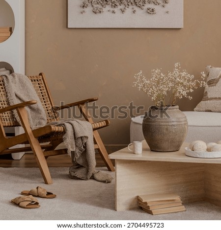 Raw textures and natural elements create a grounded aesthetic.