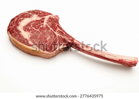 Raw Tomahawk Ribeye Steak with Bone Isolated on White Background