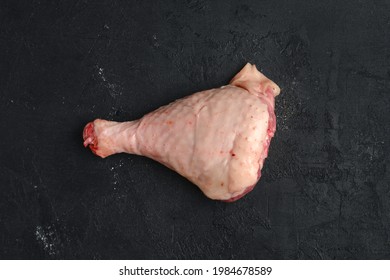 Raw Turkey Drumstick With Skin On Black Background