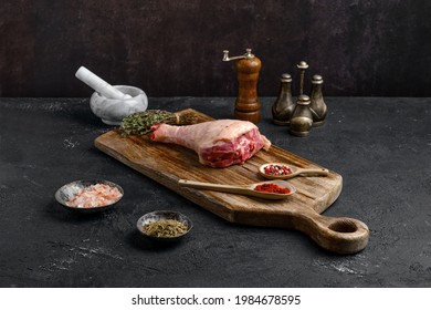 Raw Turkey Drumstick With Skin On Wooden Board