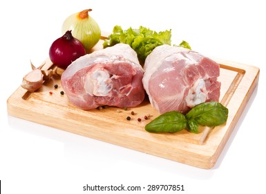 Raw Turkey Legs On Cutting Board 