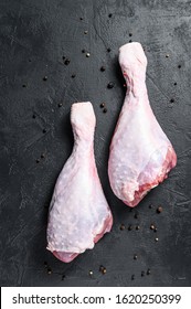 Raw Turkey Thigh With Spices. Black Background. Top View