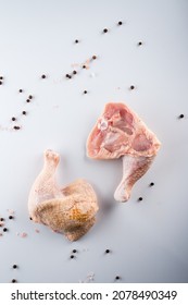 Raw Turkey Thigh With Spices On A White Background, Pair Of Fresh Cut Raw Turkey Thighs.