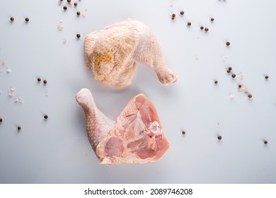 Raw Turkey Thigh With Spices On A White Background, Pair Of Fresh Cut Raw Turkey Thighs.