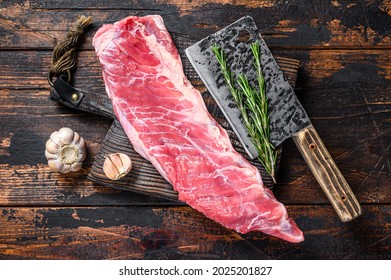 Raw Veal Brisket Meat On Short Spare Rib With Butcher Knife. Dark Wooden Background. Top View