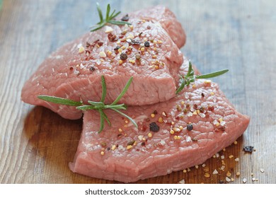 Raw Veal Meat Steak On Wooden Table