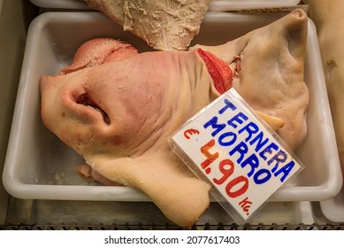 Raw veal snout for sale at a local butcher shop in Pamplona, Spain. Tag says veal snout and lists the price per kilo