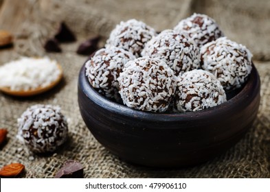 raw vegan almond butter coconut chocolate balls. toning. selective focus