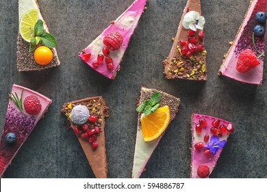 raw vegan cakes with fruit and seeds, decorated with flower, product photography for patisserie