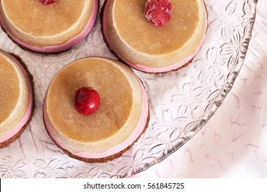 Raw Vegan Dessert With Sour Cherry Served On Glass Plate. Top View 